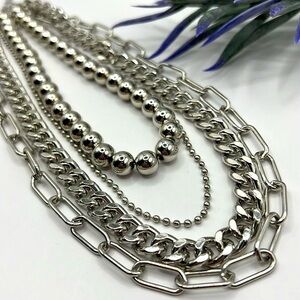 NWOT Four Strand Silver Chain Necklace.